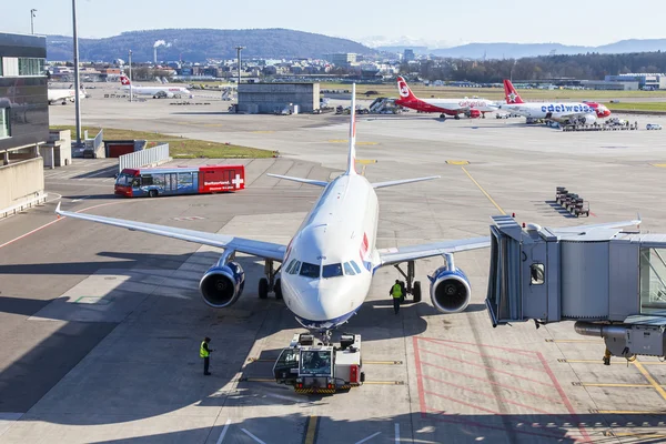 ZURICH, SWITZERLAND, on MARCH 26, 2016. Service of planes at the airport of Zurich. View from a survey terrace of the airport.