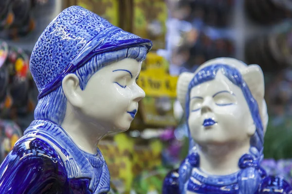 AMSTERDAM, NETHERLANDS on MARCH 27, 2016. Typical Dutch souvenirs on a show-window of the Flower market. The flower market - one of sights of the city