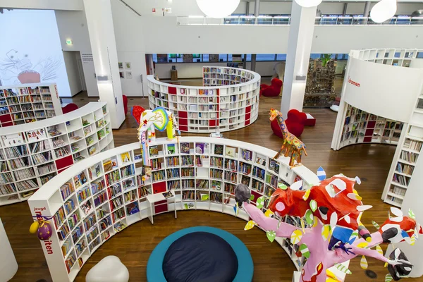 AMSTERDAM, NETHERLANDS on MARCH 28, 2016. Books on racks in a reading room in public library of Amsterdam