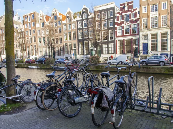 AMSTERDAM, NETHERLANDS on MARCH 27, 2016. City landscape. The bicycle parking on the embankment