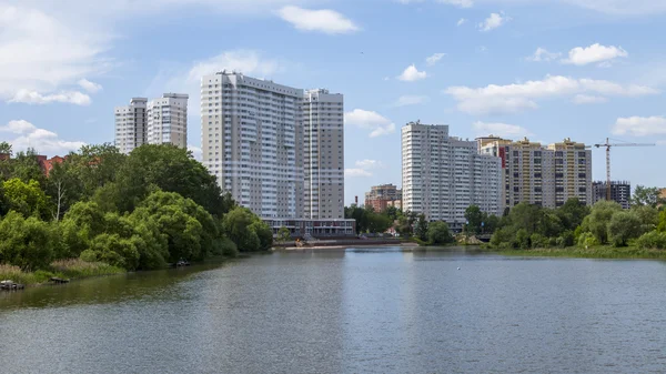 PUSHKINO, RUSSIA, on MAY 30, 2016. City landscape. Multystoried houses on the river bank of Serebryanka