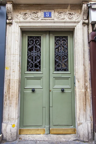 PARIS, FRANCE, on JULY 12, 2016. Typical architectural details of buildings around historical part of the city. Entrance door