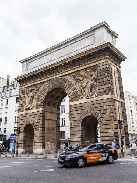 PARIS, FRANCE, on JULY 12, 2016. Typical urban view. Gate Saint Martin (La Porte St-Martin) - one of triumphal arches in the city