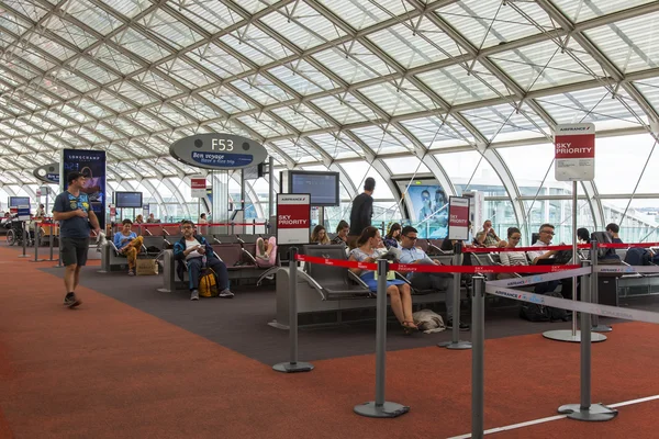 PARIS, FRANCE, on JULY 12, 2016. Passengers expect a flight gate in the hall of departures of the terminal 2F at the airport Charles de Gaulle