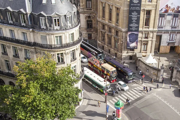 PARIS, FRANCE, on JULY 5, 2016. A typical urban view from the survey platform of the Gallery department store Lafayette. Excursion buses have stopped near the crosswalk