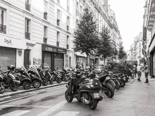 PARIS, FRANCE, on JULY 5, 2016. Typical Parisian street in the morning. Motorcycles are parked near the sidewalk