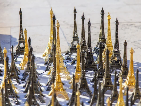 PARIS, FRANCE, on JULY 5, 2016. A show-window with charms in the form of the Eiffel Tower in shop of souvenirs