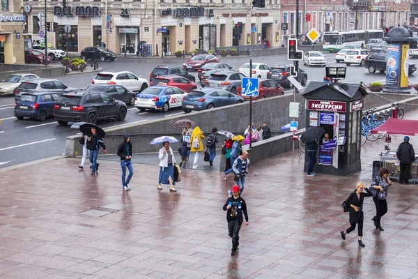 ST. PETERSBURG, RUSSIA, on August 18, 2016. Urban view. Nevsky Avenue. Pedestrians leave the underground passage during a rain