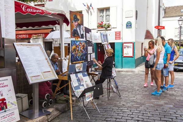 PARIS, FRANCE, on JULY 8, 2016. Montmartre, artists and tourists at Tertr Square