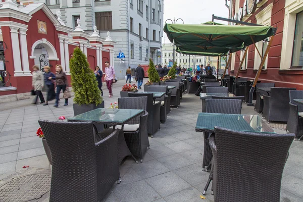 Moscow, Russia, on September 23, 2014. Foot zone in the downtown. Little tables of summer cafe