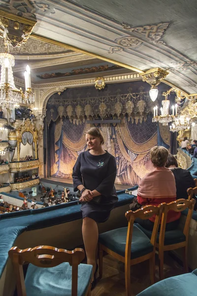 St. Petersburg, Russia, on November 2, 2014. Maryinsky Theater. The young woman sits on a box protection during a performance interval Don Quixote