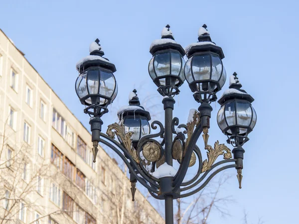 Pushkino, Russia, on January 4, 2011. Winter in the city. Boulevard. The lamp brought by snow