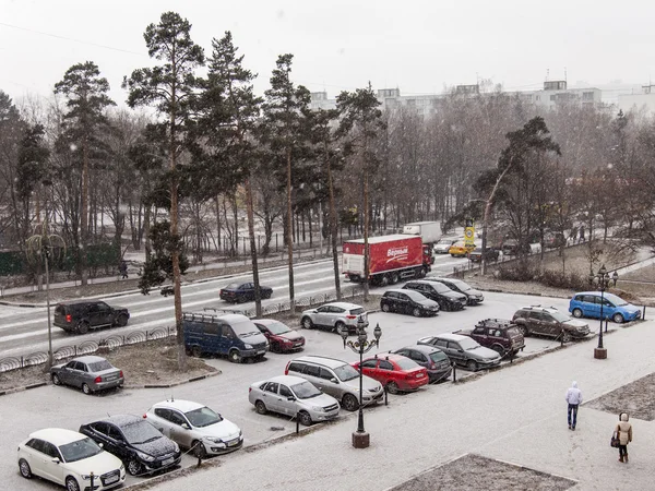 Pushkino, Russia, on December 1, 2014. A blizzard at the beginning of winter. The parking in the inhabited residential district brought by snow