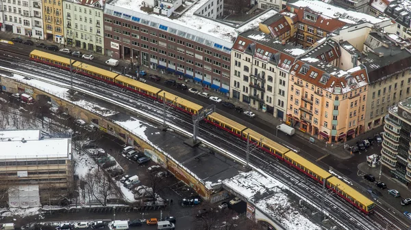 Berlin, Germany, on February 20, 2013. City landscape. A view of houses and the line a subway from height of bird\'s flight in the winter cloudy afternoon