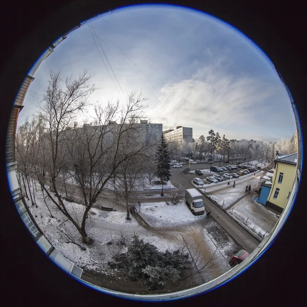 Pushkino, Russia, on January 22, 2014. A view from the window on the winter city and houses of the inhabited massif, by fisheye view
