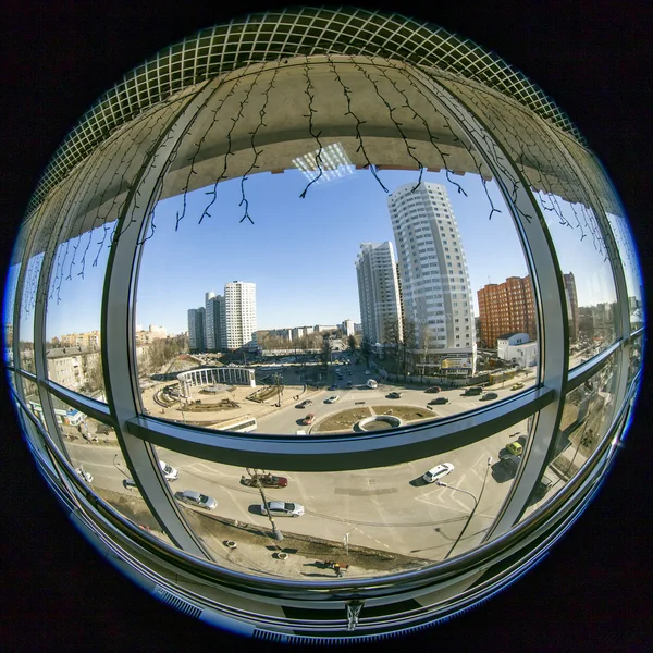 Pushkino, Russia, on March 17, 2015. A view of the city in the sunny spring afternoon from a window of shopping center, fisheye view.