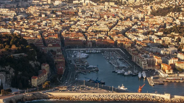 Nice, France, on March 7, 2015. The top view from a window of the flying plane on the city port and Promenade des Anglais