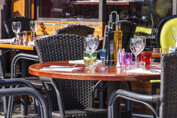 Vilfransh Sur Mer, France, on March 10, 2015. Little tables of summer cafe on the embankment. Vilfransh Sur of measures - the suburb of Nice, one of popular resorts of French riviera