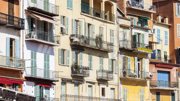 Vilfransh Sur Mer, France, on March 10, 2015. A fragment of facades of houses on the embankment. Vilfransh Sur Mer - the suburb of Nice, one of popular resorts of French riviera