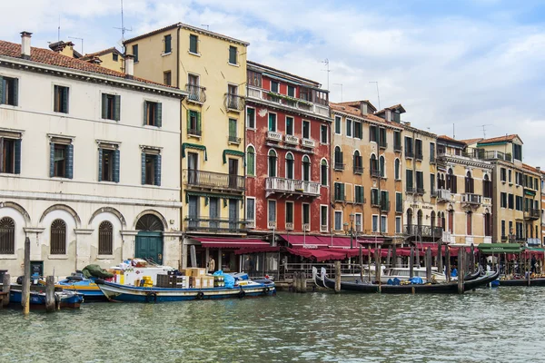 VENICE, ITALY - on APRIL 30, 2015. Typical urban view. The coast of the Grand channel (Canal Grande), the house on the coast and gondolas. The grand channel is the main transport artery of Venice and its most known channel