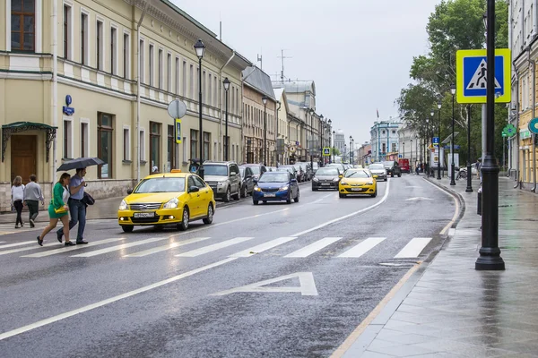 MOSCOW, RUSSIA, on MAY 24, 2015. Pokrovskaya Street. Summer day, rainy weather. Pokrovskaya Street is historical sight of the center of Moscow and one of shopping streets