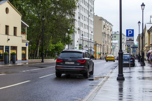 MOSCOW, RUSSIA, on MAY 24, 2015. Pokrovskaya Street. Summer day, rainy weather. Pokrovskaya Street is historical sight of the center of Moscow and one of shopping streets