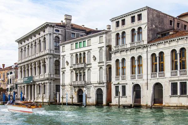 VENICE, ITALY - on APRIL 30, 2015. A view of an architectural complex of ancient buildings on the bank of the Grand channel (Canal Grande). The grand channel is the main  channel of Venice