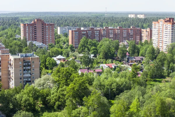 PUSHKINO, RUSSIA - on MAY 7, 2015. New multystoried houses on the river bank of Serebryank