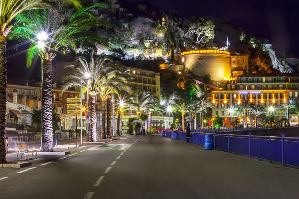 NICE, FRANCE, on MARCH 13, 2015. An English promenade (Promenade des Anglais) in evening. Belland's tower (Tour Bellanda). Promenade des Anglais - one of the most beautiful embankments in Europe