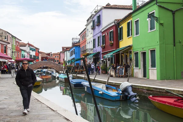VENICE, ITALY, on APRIL 30, 2015. Multi-colored lodges on the canal embankment on Burano\'s island. Burano - one of islands of the Venetian lagoon