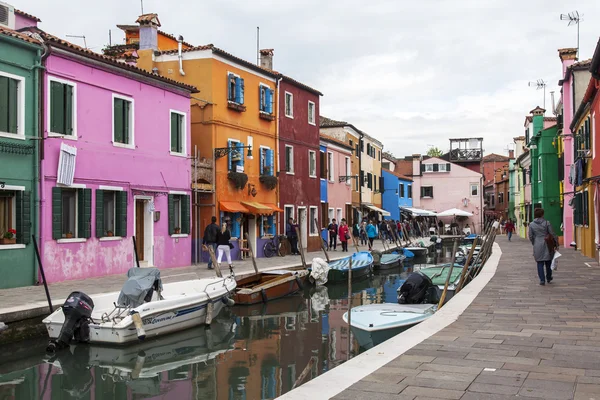 VENICE, ITALY, on APRIL 30, 2015. Burano island, typical street canal and multi-colored houses of locals. Burano the island - one of attractive tourist objects in the Venetian lagoon