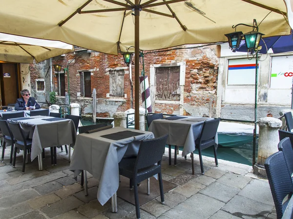 VENICE, ITALY - on MAY 3, 2015. Summer cafe on the bank of the Grand channel (Canal Grande)