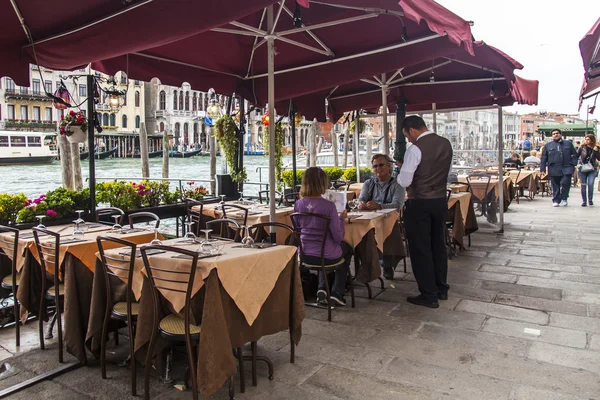 VENICE, ITALY - on MAY 3, 2015. Summer cafe on the bank of the Grand channel (Canal Grande)