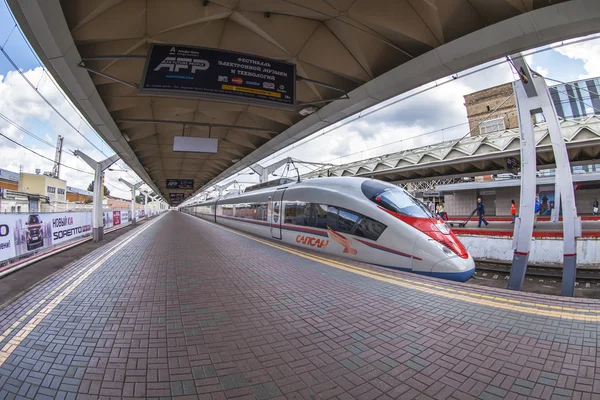 MOSCOW, RUSSIA, on JULY 15, 2015. The modern high-speed train Sapsan near the platform of the Leningrad station, passengers go on the platform, Fisheye view.