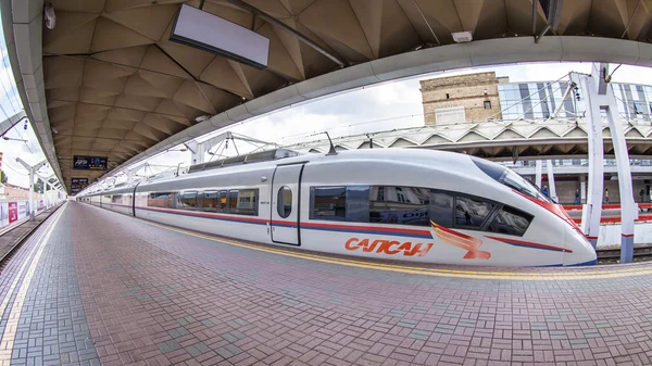 MOSCOW, RUSSIA, on JULY 15, 2015. The modern high-speed train Sapsan near the platform of the Leningrad station, passengers go on the platform, Fisheye view.