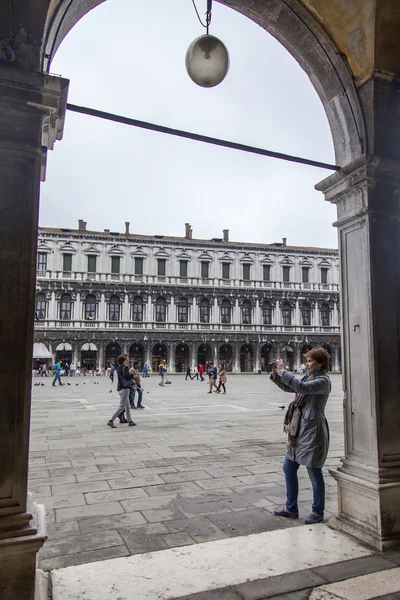 VENICE, ITALY - on MAY 4, 2015. Tourists walk on San-Marko Square - the main city square