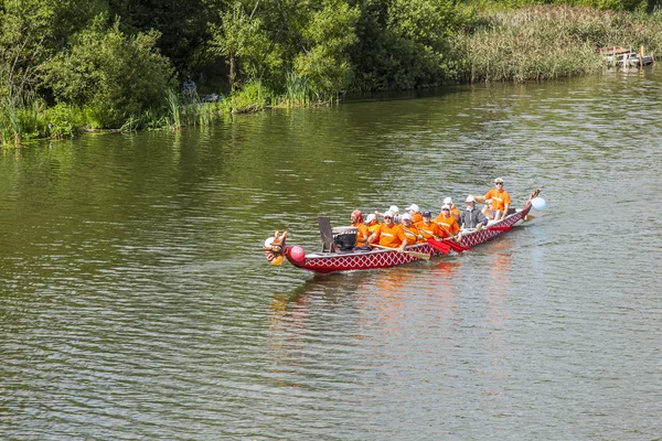 PUSHKINO, RUSSIA - on AUGUST 15, 2015. The team of oarsmen trains before a water holiday on Serebryank\'s river