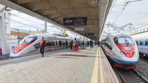 MOSCOW, RUSSIA, on AUGUST 19, 2015. Leningrad station. Two modern high-speed trains Sapsan near a platform expect departure to St. Petersburg