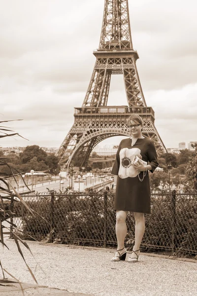 PARIS, FRANCE, on SEPTEMBER 1, 2015. The tourist is photographed near the Eiffel Tower
