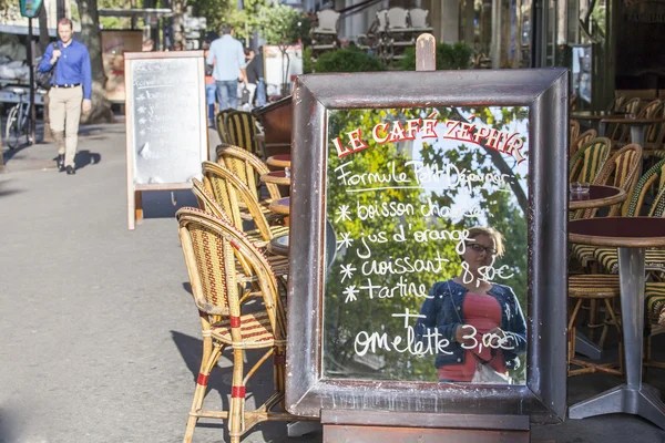 PARIS, FRANCE, on AUGUST 26, 2015. The menu of summer cafe on the city street written on a mirror