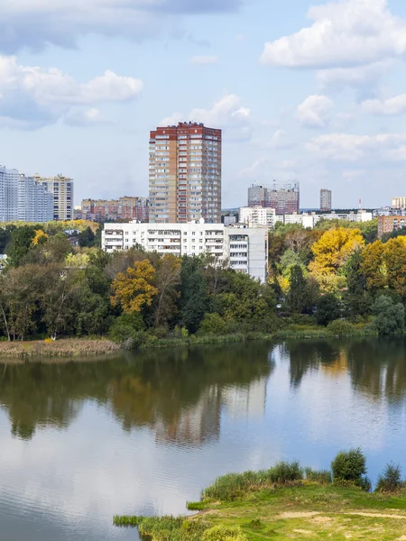 PUSHKINO, RUSSIA - on SEPTEMBER 15, 2015. City landscape in the autumn afternoon. Houses on the river bank of Serebryanka