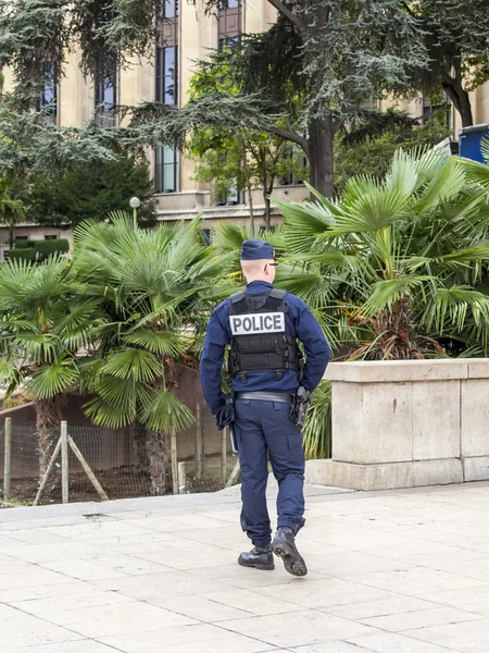 PARIS, FRANCE, on AUGUST 29, 2015. The police officer patrols the street