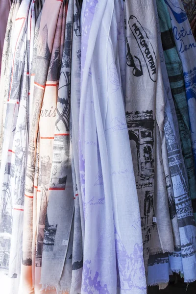 PARIS, FRANCE, on AUGUST 27, 2015. Textile products with the French prints on a show-window of shop of souvenirs