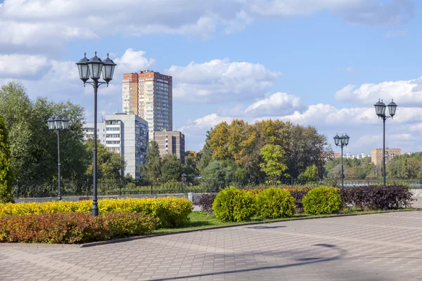 PUSHKINO, RUSSIA - on SEPTEMBER 15, 2015. City landscape in the autumn afternoon. Houses on the river bank of Serebryanka