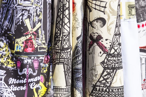 PARIS, FRANCE, on AUGUST 29, 2015. Textile products with the image of the Parisian sights on a show-window of shop of souvenirs