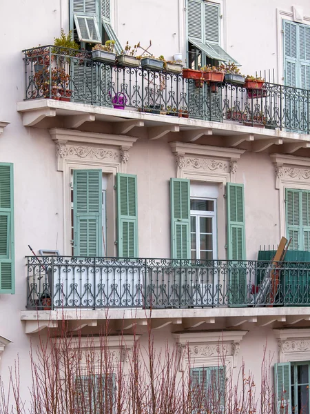 NICE, FRANCE, on JANUARY 7, 2016. Typical architectural details of houses in historical part of the city. Window and balcony.