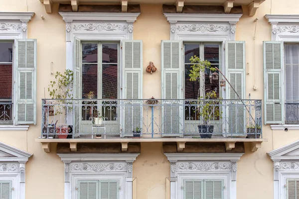 NICE, FRANCE, on JANUARY 7, 2016. Typical architectural details of houses in historical part of the city. Window and balcony.