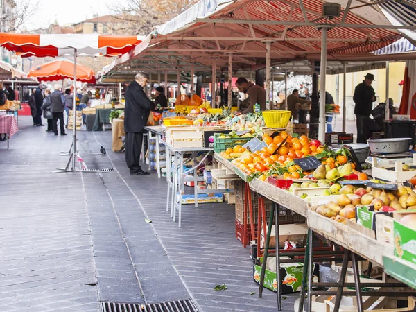 NICE, FRANCE, on JANUARY 7, 2016. Counters with various vegetables and fruit in the Cours Saleya market