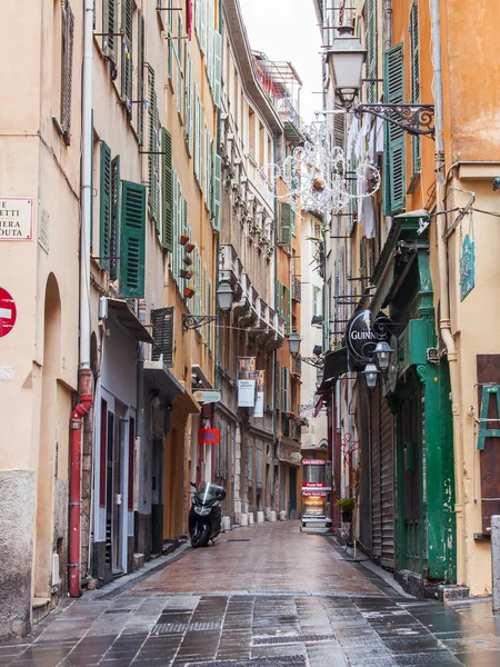 NICE, FRANCE - on JANUARY 11, 2016. Typical urban view. The narrow curve street in the old city