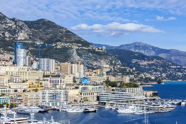 MONTE-CARLO, MONACO, on JANUARY 10, 2016. A view of houses on a slope of the mountain and the yacht at the mooring in a bay